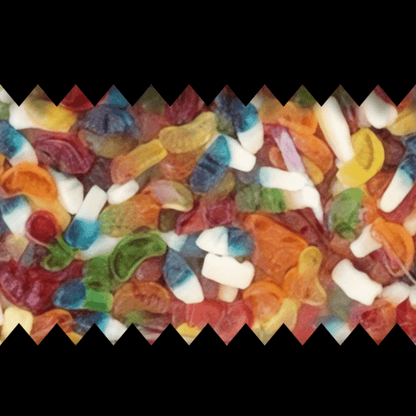 Assorted colorful gummy candies in a clear bag on a black background