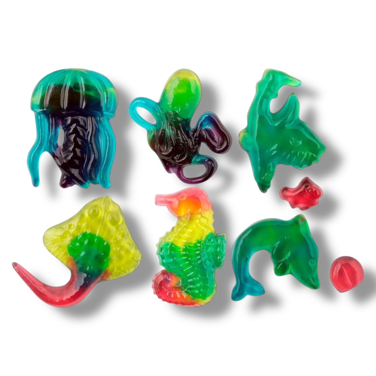 Colorful jellyfish-shaped gummy candies on a white background