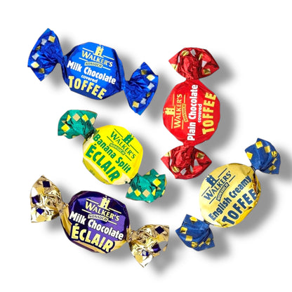 Assorted Walker's chocolate toffee candies in colorful wrappers on a white background